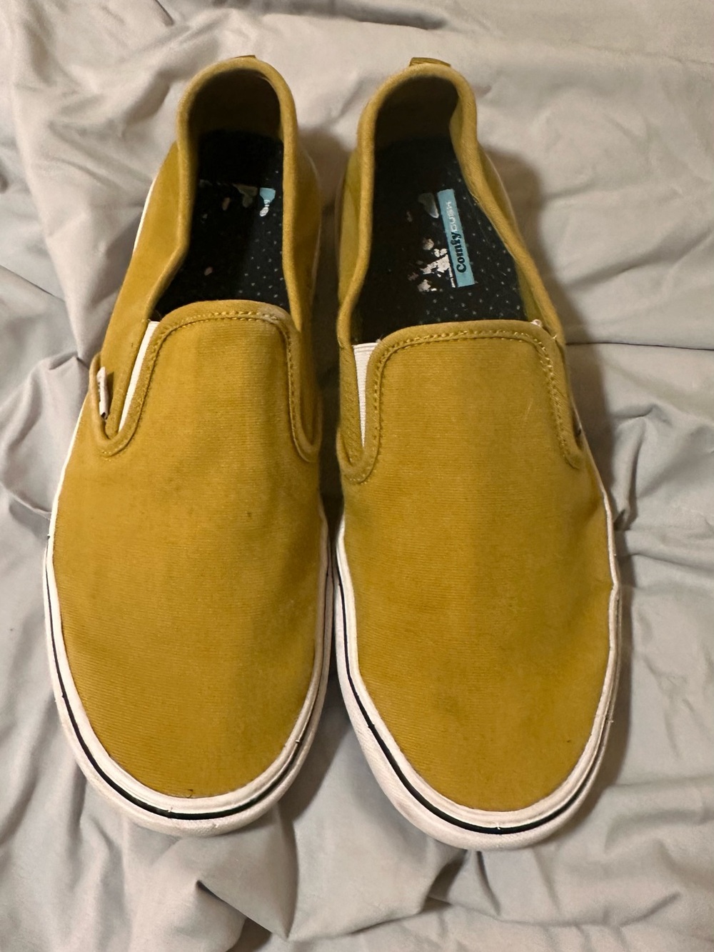 Vans Slip-On Canvas Sneakers in Mustard Yellow
